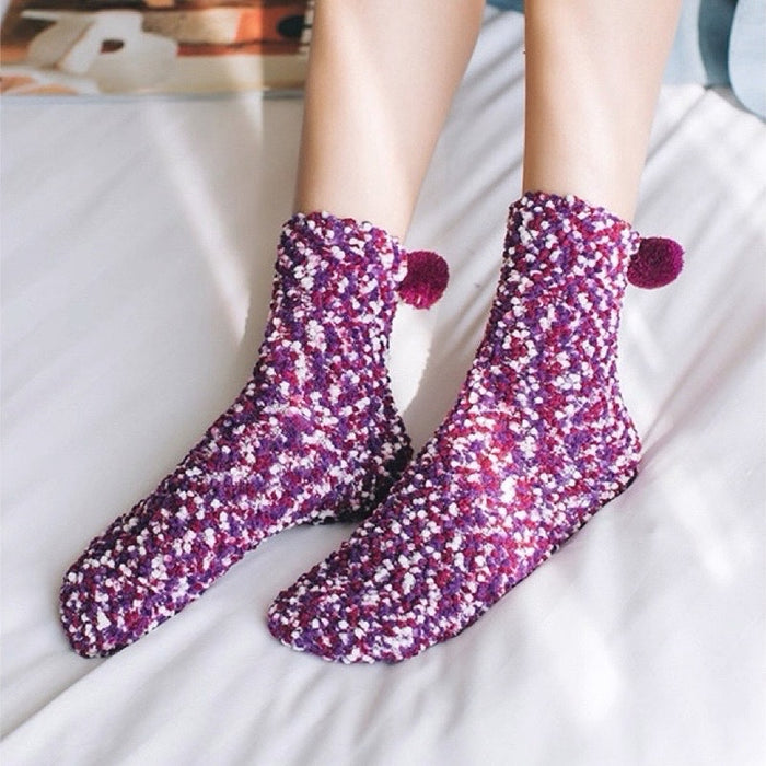 Model wearing a pari of Pompom Cupcake Socks in purple, easy to pack for travel and errands.