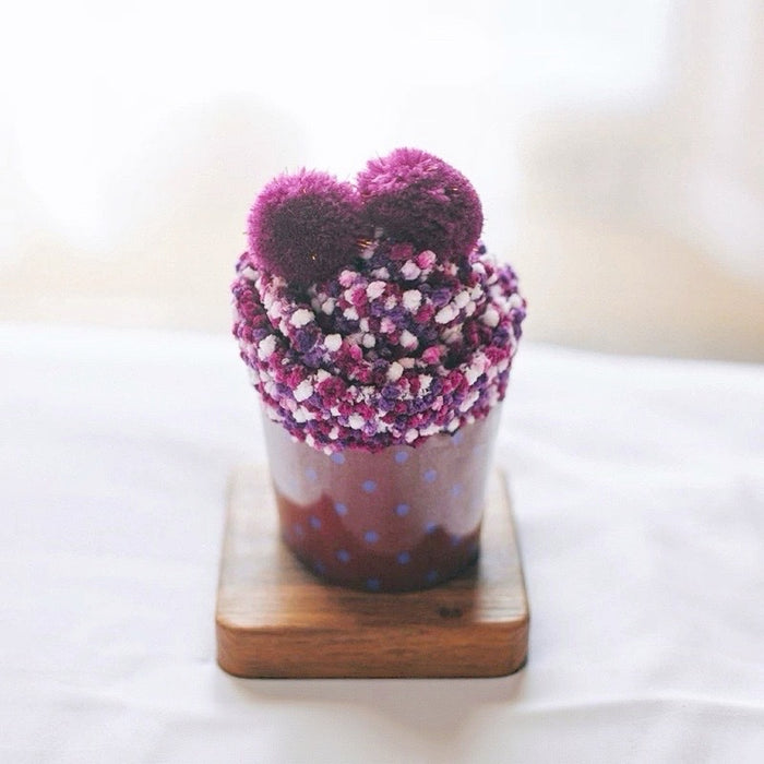 Angled view of Pompom Cupcake Socks in purple, great for daily wear and lounging.