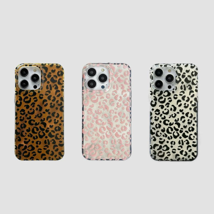 Three silicone iPhone cases with leopard print in brown, pink, and black/white. Safari chic collection.