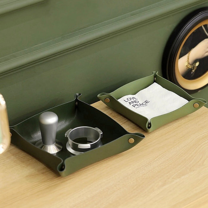 Angled view of  two green PU Leather Tray on a table, easy for storage.