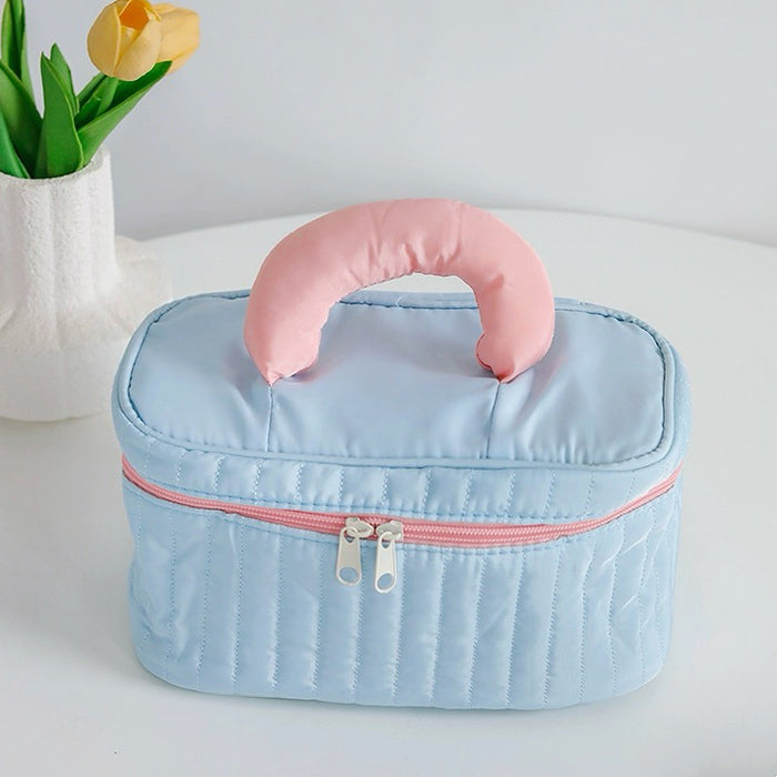 Close-up of Puffy Candy Makeup Box in blue, easy to pack for trips.