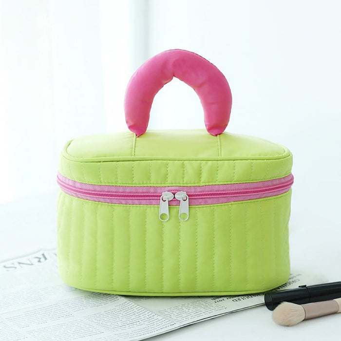 Flat lay of Puffy Candy Makeup Box  in green , ideal for travel makeup and toiletries.