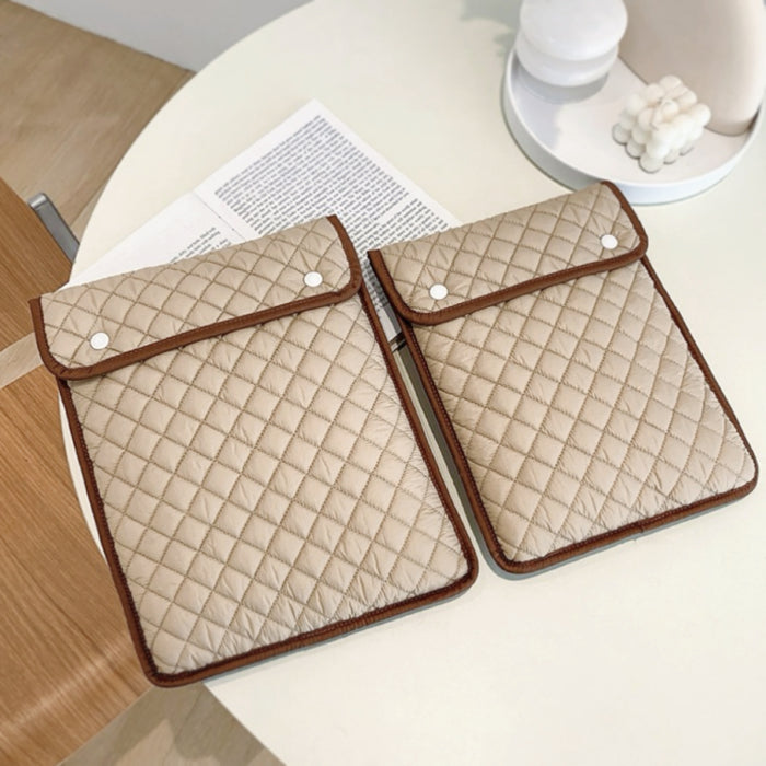 Two khaki cotton puffy diamond quilted laptop sleeves with brown trim and snap closures. ideal for errands and gifting.