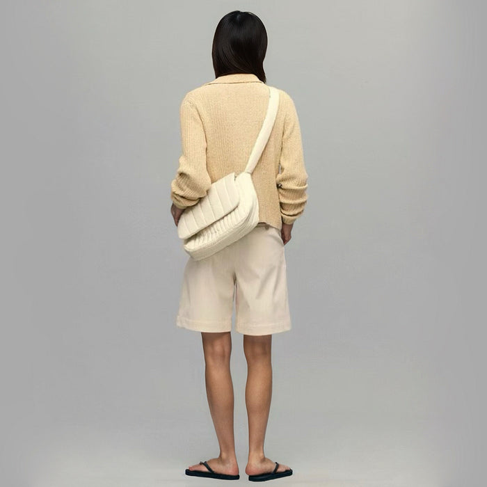 Model carrying a beige polyester bag as crossbody, ideal for city walks and gifting.