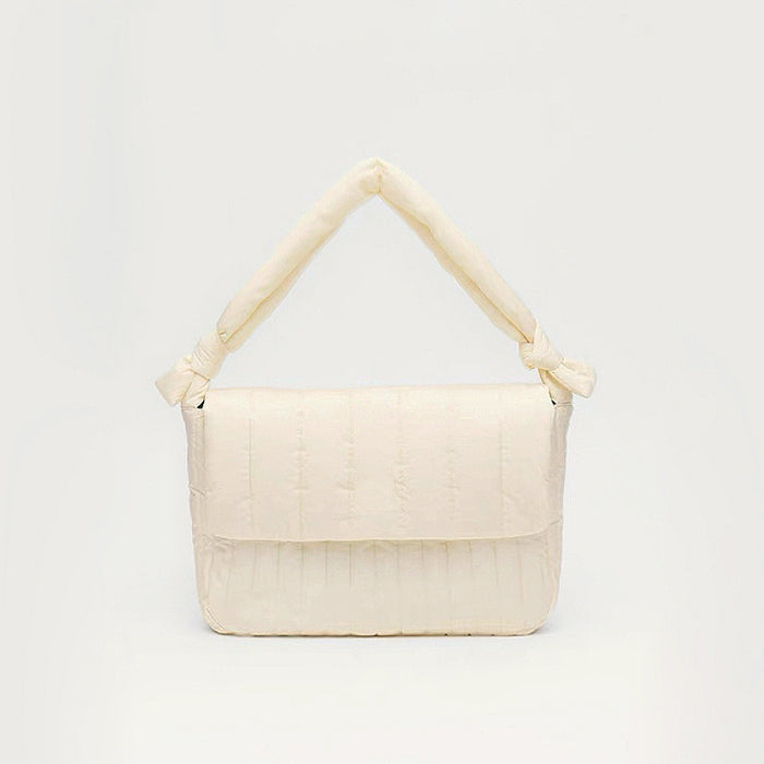 Front view of Puffy Knot Quilted Bag in cream white, great for everyday carry and travel.