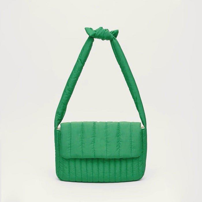 Front view of green Puffy Knot Quilted Bag in long strap style, great for everyday carry and travel.