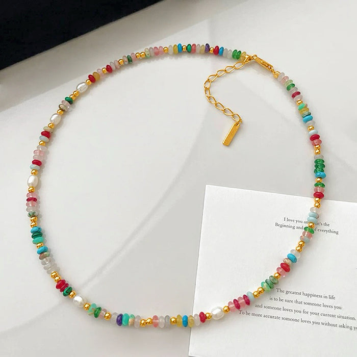 Close-up of Rainbow beaded necklace featuring a colorful bead arrangement.