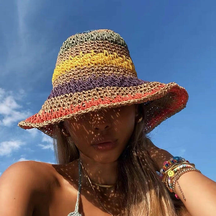 Model wearing a khaki rainbow foldable straw hat, a lightweight accessory perfect for a stylish summer outfit.