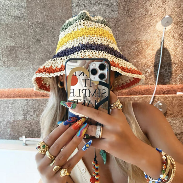 Model wearing Rainbow Foldable Straw Hat in beige, featuring a flexible woven brim for stylish sun protection.