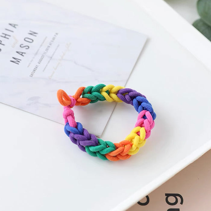 Model wearing a Rainbow Hair Ring , ideal for quick updos and ponytails.