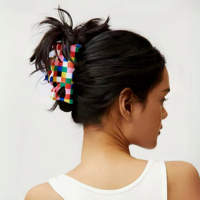 Model wearing Rainbow plaid acrylic claw, easy for workdays and special occasions.