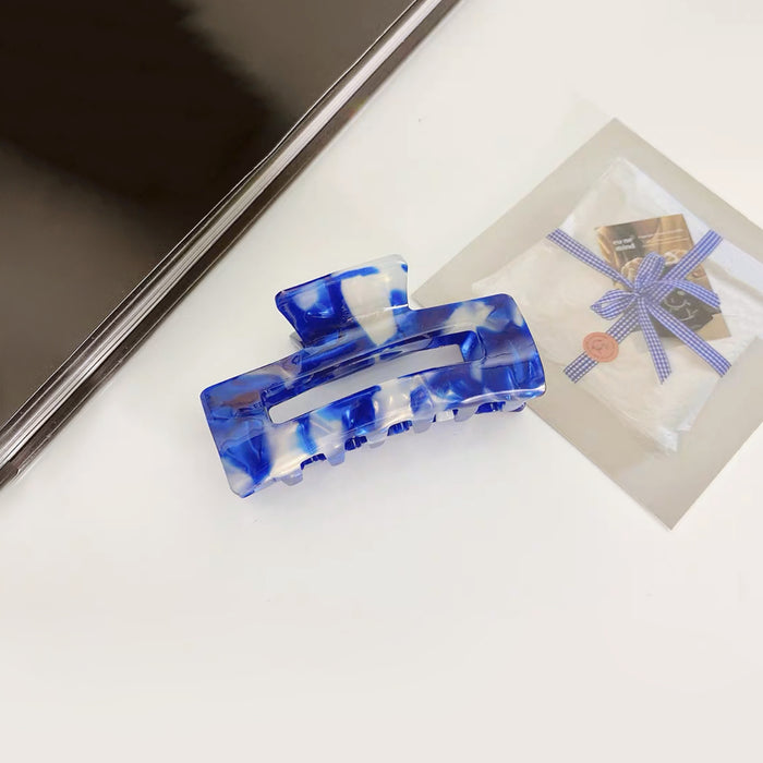 Angled view of Rectangle Hair Claw in blue, ideal for quick updos and ponytails.