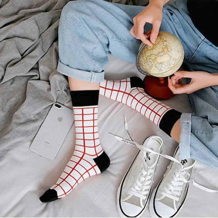 Model wearing a pair of red checkered cotton socks, ideal for everyday outfits and sneakers; for office.