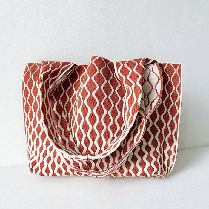 Close-up of Ripple Texture Tote Bag in rust red, ideal for errands and gifting.