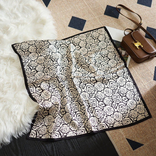 Front view of Rose silk scarf, with a black and white rose pattern, great for office layering.