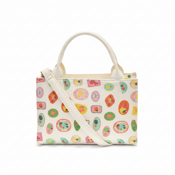 Handbag with colorful fruit pattern on a white background