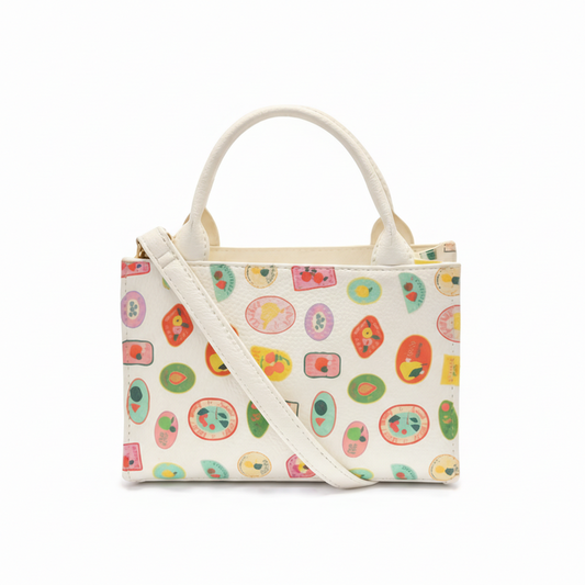 Handbag with colorful fruit pattern on a white background
