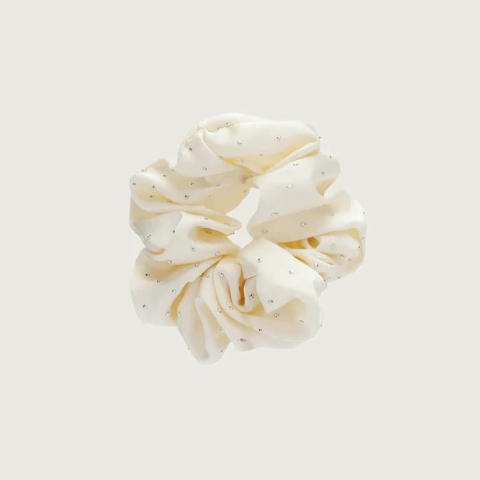 Angled view of Satin Scrunchie With Rhinestones in white, ideal for quick updos and ponytails.