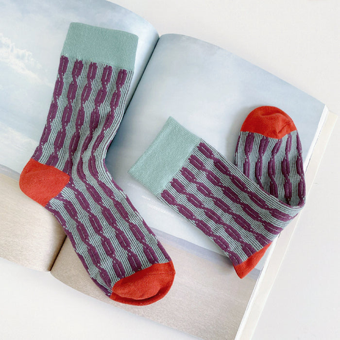 Flat lay of Sculptured Ripple Knitted Socks in green, great for daily wear and lounging.