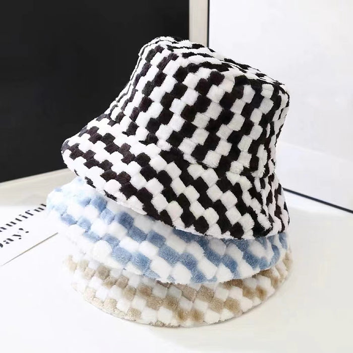 Stacked sherpa checkered bucket hats in black, light blue, and beige, showcasing a soft plush winter texture.