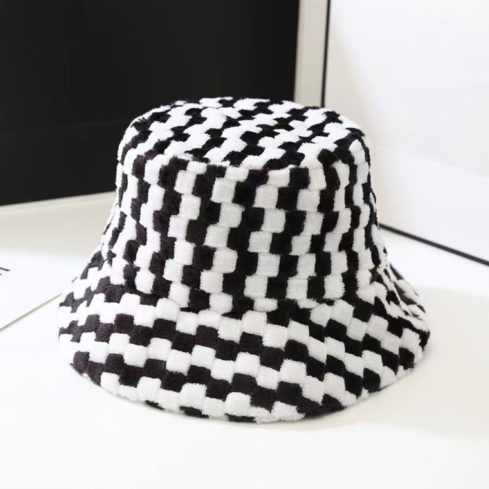 Fluffy black and white checkered sherpa polyester bucket hat, designed for cozy and stylish cold-weather warmth.