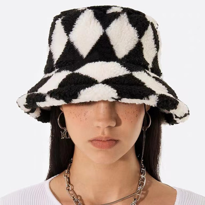 Black and white sherpa diamond check bucket hat, crafted from soft polyester in a sophisticated cozy style.
