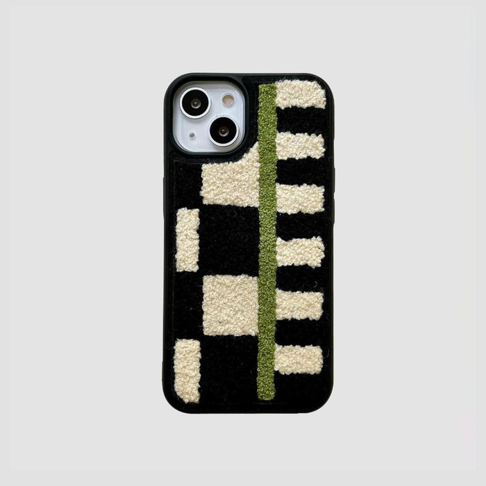 Sherpa Green Stripe case with black and cream geometric patterns and a vertical green stripe.