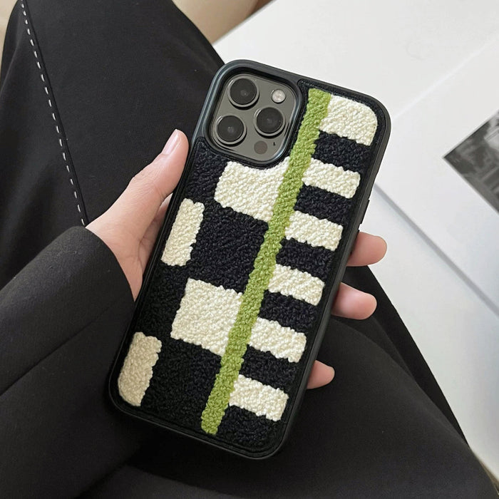 Close-up of case being held, showcasing its lush plush texture and precise camera cutout.
