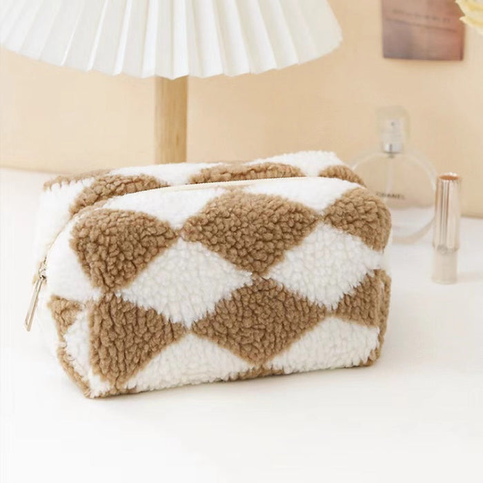 Front view of khaki and white sherpa teddy makeup bag with a diamond pattern and zipper closure.