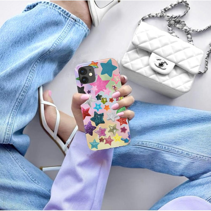 Silicone Shining Stars case with glitter stars, held by a person next to a quilted bag.