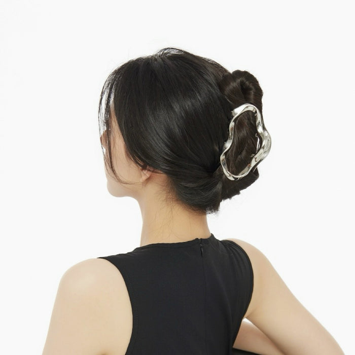 Model wearing a Silver Cloud hair claw, ideal for quick updos and ponytails.