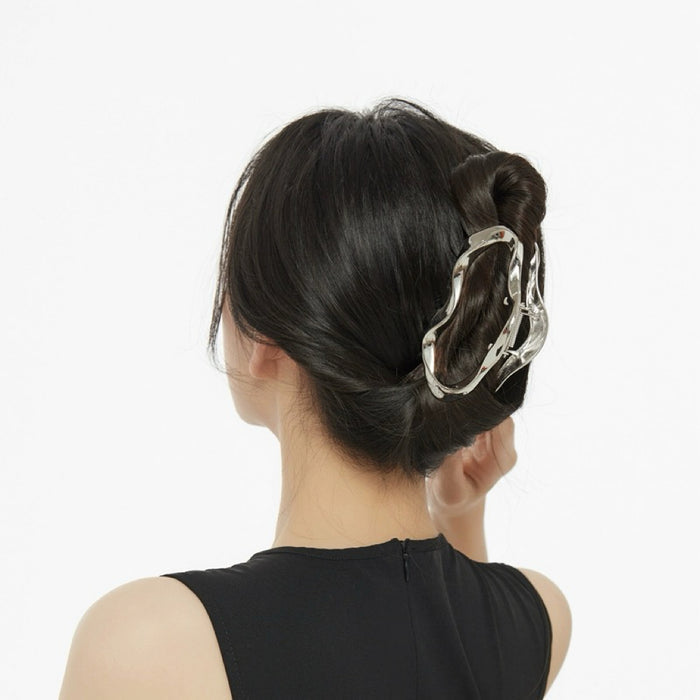 Model wearing a Silver Cloud hair claw, easy for workdays and special occasions.