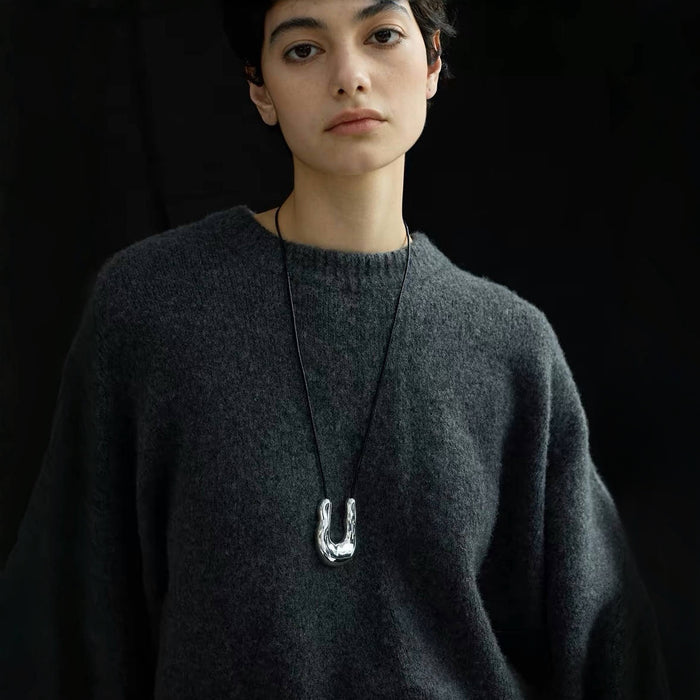 Model wearing a silver Crescent Pendant Necklace, ideal for everyday wear and layering.