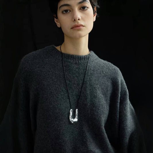 Model wearing a silver Crescent Pendant Necklace, ideal for everyday wear and layering.