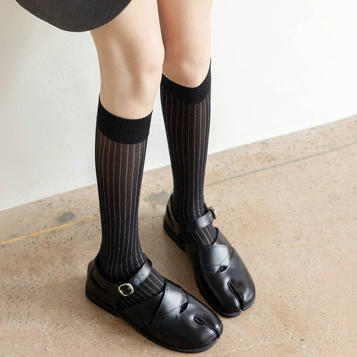 Model wearing black Striped Split-Toe Socks in knee-high, easy to pack for travel and errands.