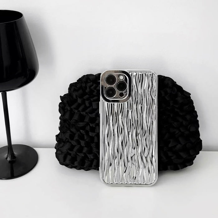 Silver water ripple design silicone case with a protective metallic camera bezel.