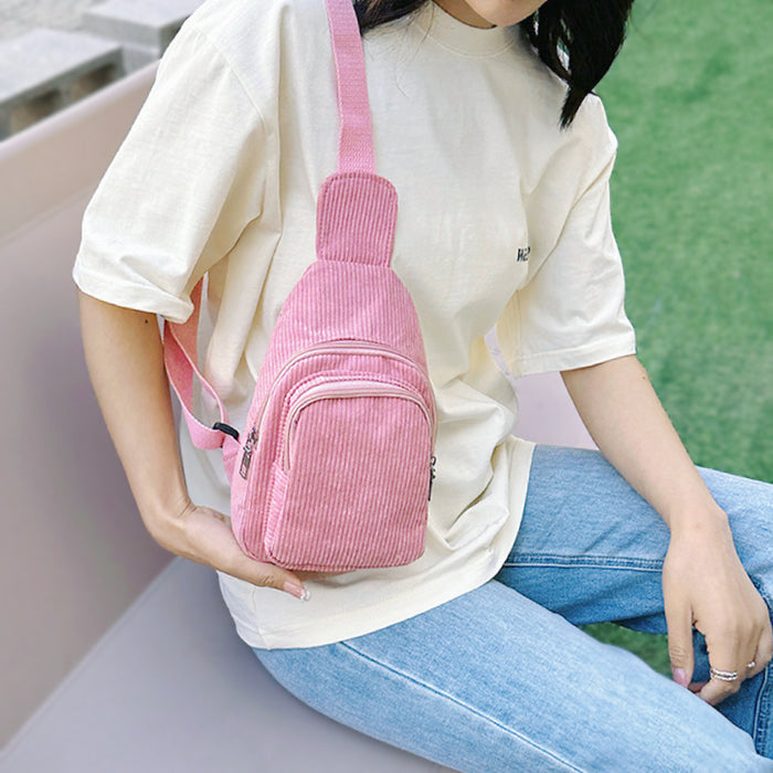 Model carrying a pink sling bag on the shoulder, ideal for city walks and gifting.