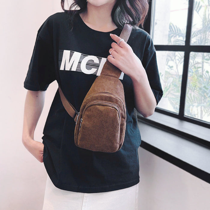 Model carrying a brown sling bag as crossbody, easy for commuting and weekends.