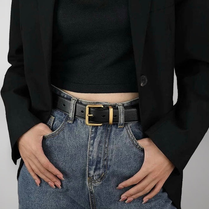 Model wearing the black belt with simple square buckle for minimalist style.