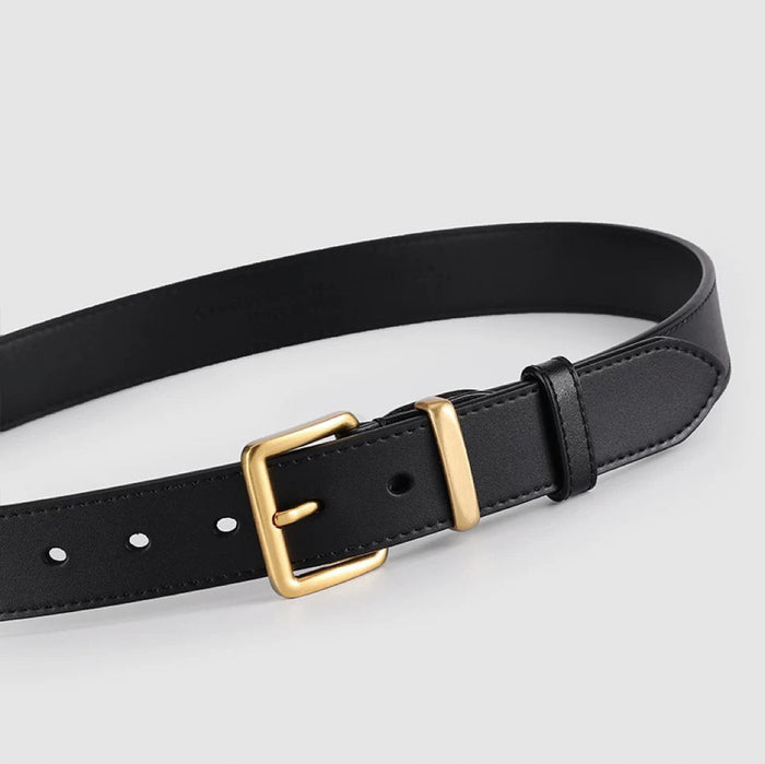Close-up of black PU leather belt with a simple square gold buckle.