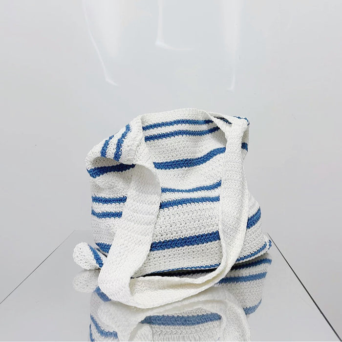 Folded view of blue Simple Striped Knitted Bag, easy for commuting and weekends.