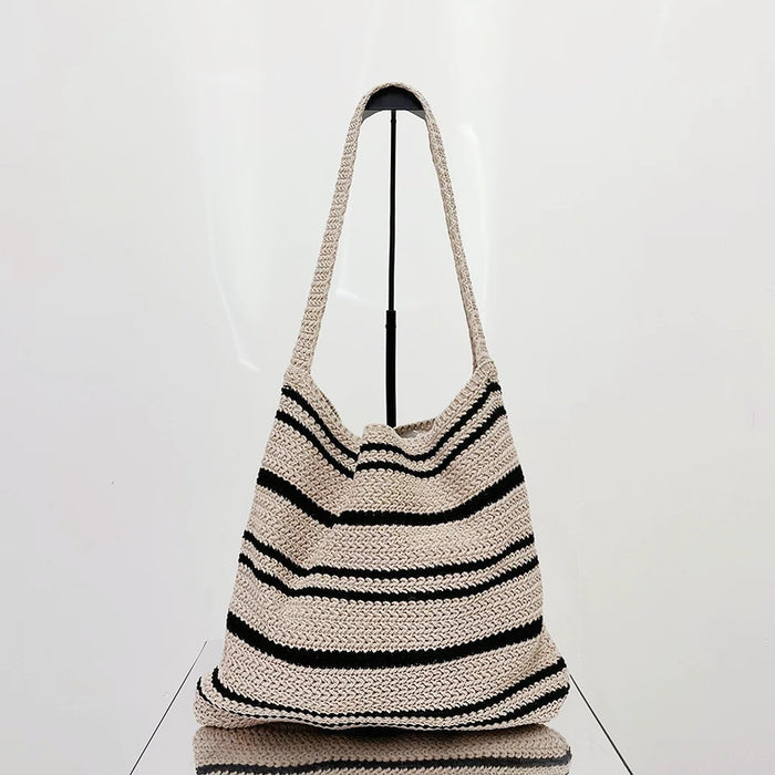 Flat lay of Simple Striped Knitted Bag in oat, great for everyday carry and travel.