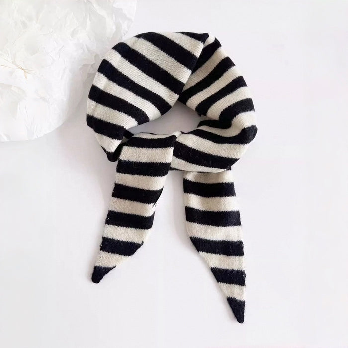 Angled view of Simple Striped Triangle Scarf in gray and black, great for office layering and commuting.