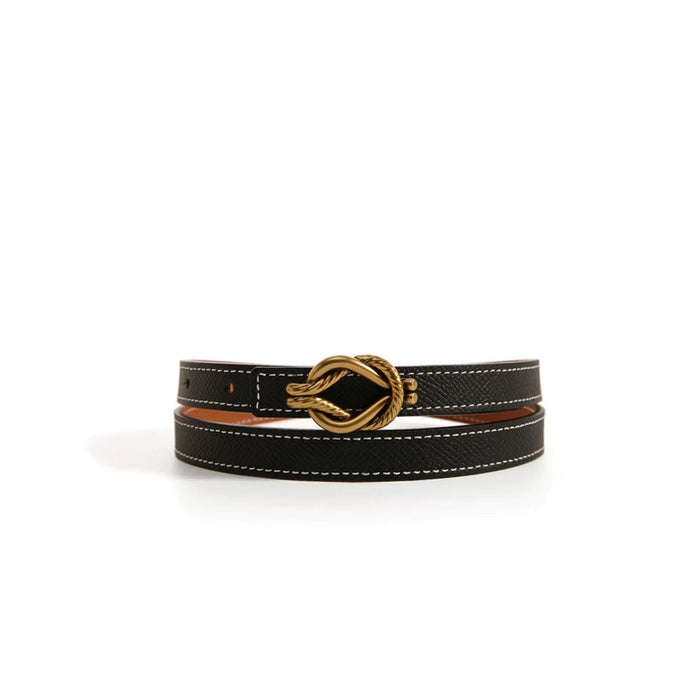 Black PU leather skinny dress belt with white stitching and a gold knot buckle.