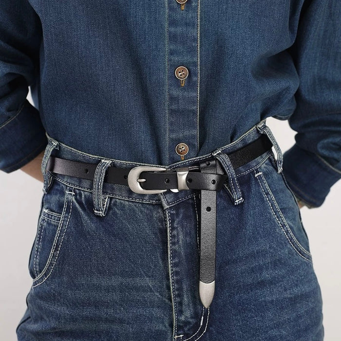 Close-up of the sleek edge belt detail styled on a denim outfit.