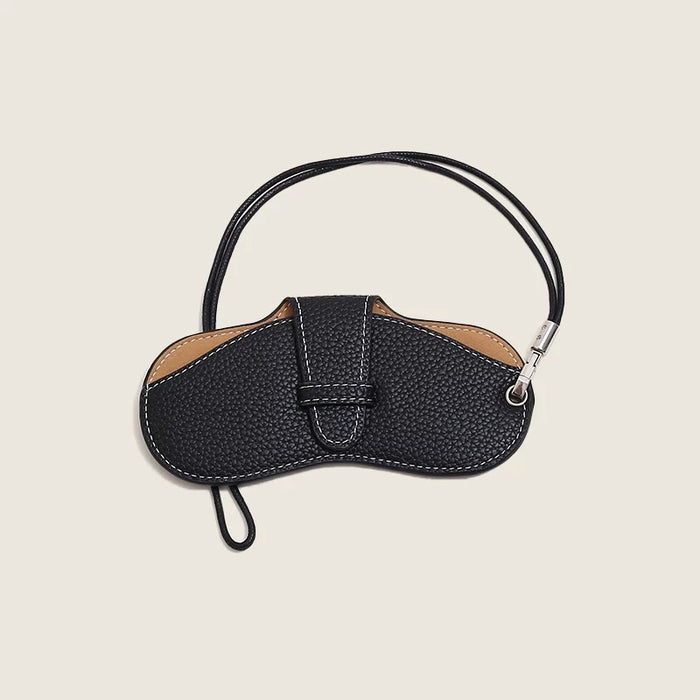 Front view of Black PU leather lychee glasses case with white stitching and a strap.