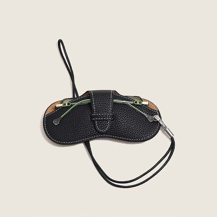 Angled view of Sleek Lychee Glasses Case with a pair of glasses inside, easy for travel packing and storage.