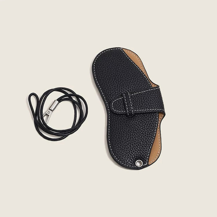 Close-up of Sleek Lychee Glasses Case with the detached strap placed to beside.
