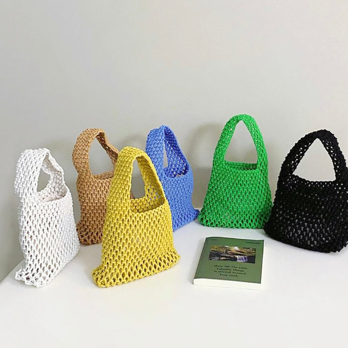 Front view of Six small multi-colored crochet cotton rope handbags in white, brown, yellow, blue, green, and black.