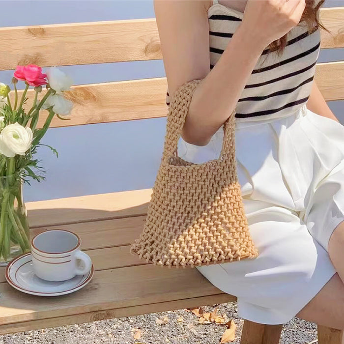 Model carrying a Small Multi-Colored Crochet Handbag in khaki, great for everyday carry and travel.